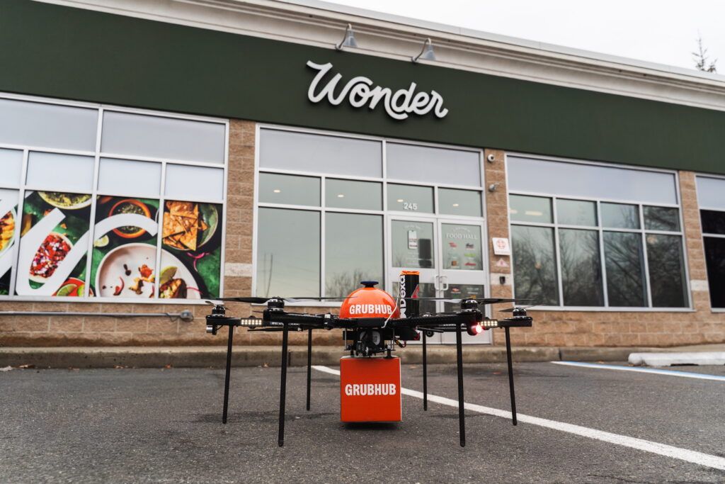 Drone In Parking Lot Holding Grubhub Package