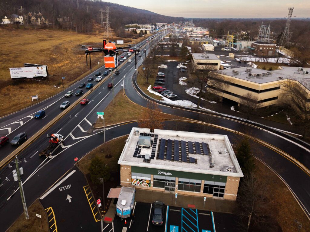 Drone Flying Over Buildings Holding Grubhub Package