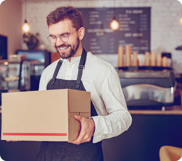 Male Shop Owner With Box
